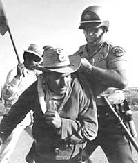 Striker arrested during 1973 grape strike. Photo: Rick Tejada-Flores